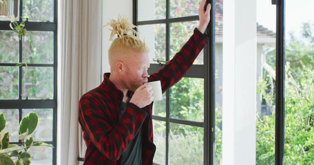 Person enjoying morning coffee looking out window greenery outisde - Download Free Stock Images Pikwizard.com