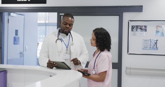 Healthcare Professionals Discussing Patient Information in Clinic - Download Free Stock Images Pikwizard.com