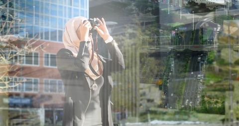 Woman in hijab exploring urban cityscape with binoculars