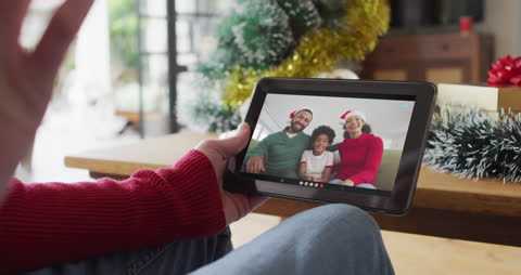 Joyful Christmas Video Call with Using Tablet for Celebrations