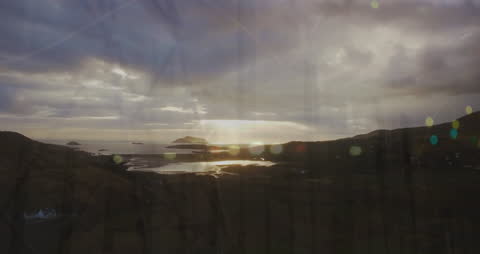 Financial Graph Animations Over Scenic Cloudy Landscape