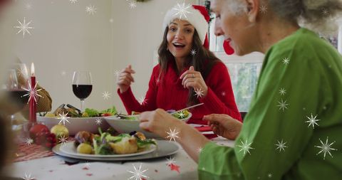 Family Celebrating Christmas Dinner with Joyful Conversation