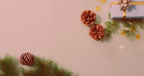 Festive Holiday Decoration with Gift and Cones - Download Free Stock Images Pikwizard.com