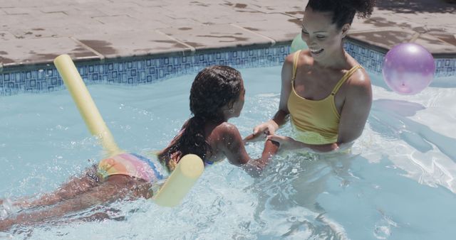 Mother and Daughter Enjoying Fun Pool Activities Together - Download Free Stock Images Pikwizard.com