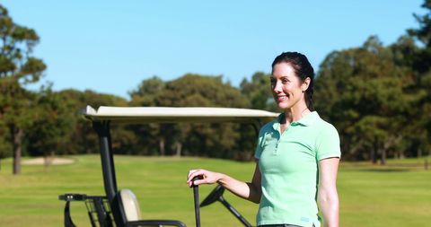 Happy Female Golfer at Golf Course on Sunny Day - Download Free Stock Images Pikwizard.com