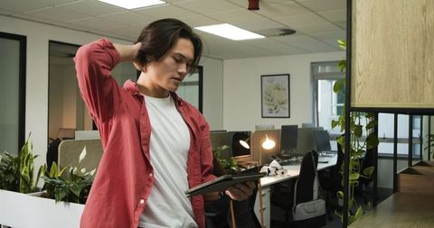 Modern Office Worker Solving Problem with Digital Tablet