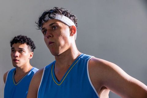 Motivated Young Athletes Standing in a Gym