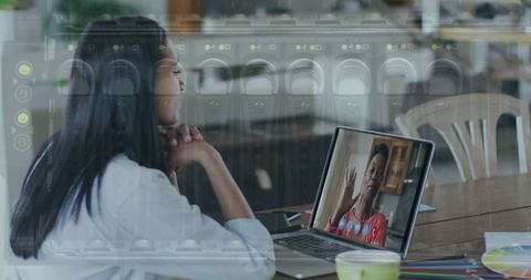 Businesswoman Engaging in Virtual Meeting Overlayed with Modern Tech Elements - Download Free Stock Images Pikwizard.com