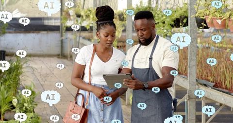 Co-workers utilizing ai technology for modern horticulture