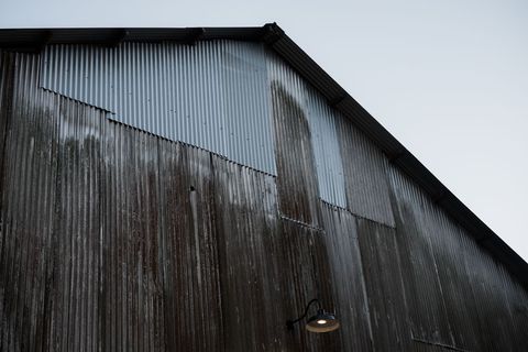 Rustic Warehouse Exterior with Vintage Corrugated Metal Roof