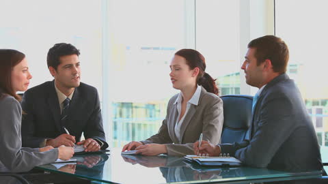 Professional Team During Corporate Meeting in Office