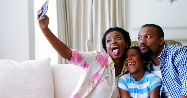 Joyful African American family taking selfie at home - Download Free Stock Images Pikwizard.com