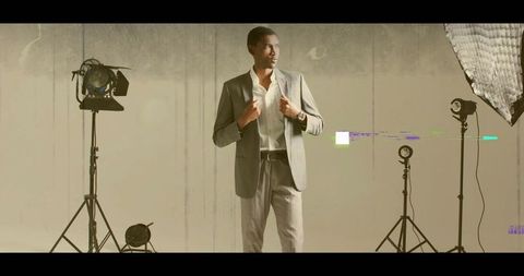 Mid-adult male models gray suit in studio photoshoot