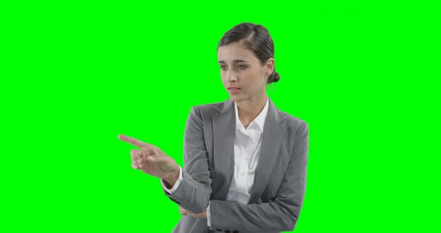 Businesswoman Pointing Finger In Professional Attire On Green Screen - Download Free Stock Images Pikwizard.com
