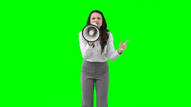 The woman is using a megaphone, possibly making an important announcement. This dynamic visual is ideal for concepts related to communication, leadership in the workplace, or making a bold statement. The green screen background allows for easy customization or insertion into various contexts.