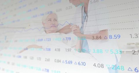 Senior healthcare: nurse assisting elderly patient in hospital bed