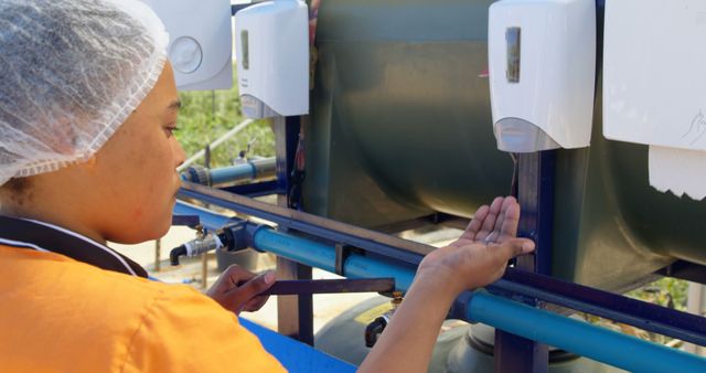 Factory Worker Using Hand Sanitizer at Industrial Facility - Download Free Stock Images Pikwizard.com