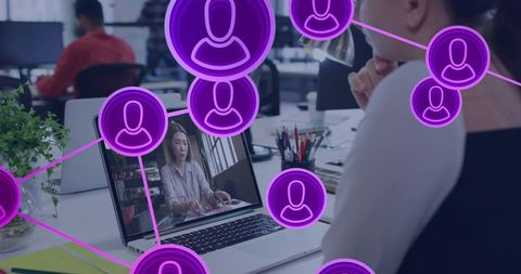 Asian woman working on laptop video calling colleague with purple networking overlay