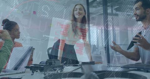 Team Collaborating on Innovative Tech Project in Modern Office