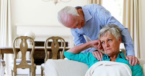 Elderly Couple Arguing in Living Room at Home