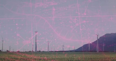 Wind turbines spinning across green farmland with futuristic pink digital dna overlay