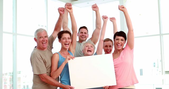 Diverse Group Celebrating Success Holding Blank Sign - Download Free Stock Images Pikwizard.com