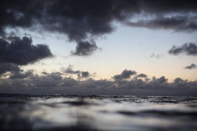 Dramatic Cloudy Sky Over Calm Ocean Waters - Download Free Stock Photos Pikwizard.com