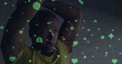Athlete holding arms behind head gazing through holographic health network overlay