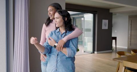 Interacial Couple Enjoying Cozy Moment in Modern Home Interior