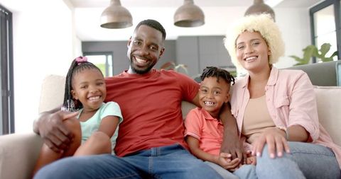 Happy Family Spending Quality Time Together on Sofa