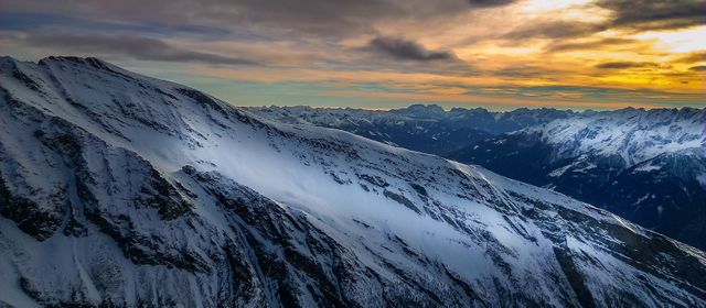 Dramatic Sunset Over Snow-Covered Mountain Range in Winter - Download Free Stock Photos Pikwizard.com
