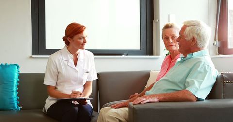 Nurse Gives Care and Attention to Seniors in Retirement Facility