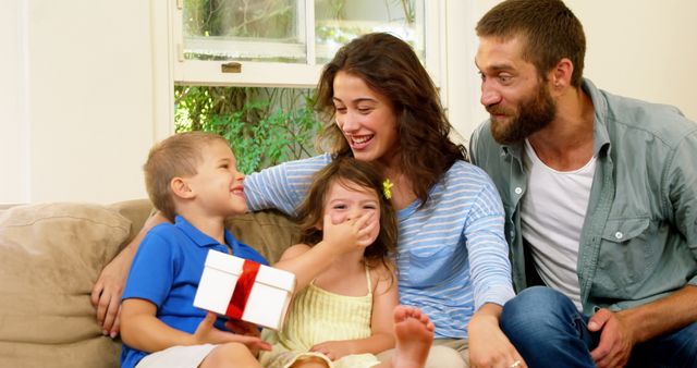 Happy Family Celebrating Special Occasion with Gift Giving - Download Free Stock Images Pikwizard.com