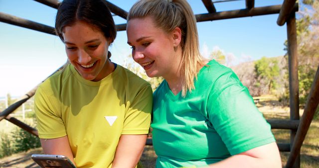 Two Women Enjoying Outdoor Workout and Checking Fitness Progress - Download Free Stock Images Pikwizard.com