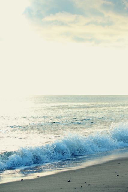 Tranquil Beach Waves Under Soft Daylight - Download Free Stock Photos Pikwizard.com