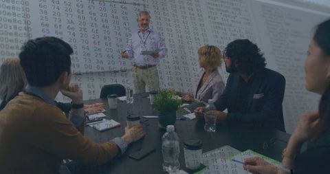 Business People Analyzing Financial Data in Meeting