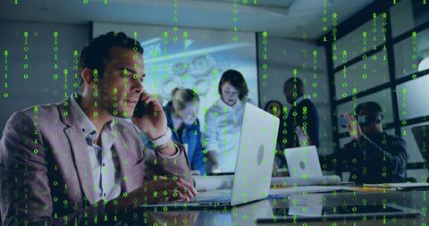 Mid-adult Man Calling and Typing on Laptop in Team Meeting with Green Cyber Overlay