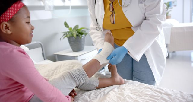 Doctor Applying Bandage to Child's Foot in Hospital - Download Free Stock Images Pikwizard.com