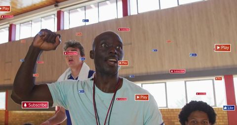 Energetic coach motivating team with spirit in gymnasium