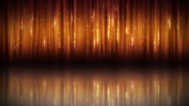 Glowing orange lights create shimmering vertical lines with reflections on a smooth surface. The bright sparkles and bokeh effect make it perfect for festive or celebratory designs, event invitations, holiday backgrounds, digital wallpapers, and dynamic presentations.