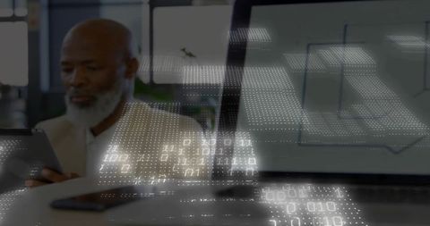 Senior executive analyzing data on tablet in modern office