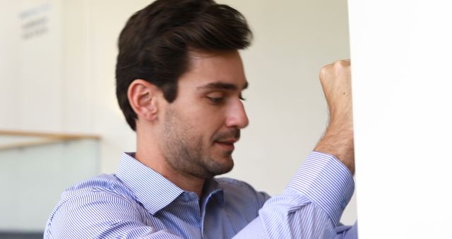 Focused Man in Business Attire Writing on Whiteboard - Download Free Stock Images Pikwizard.com