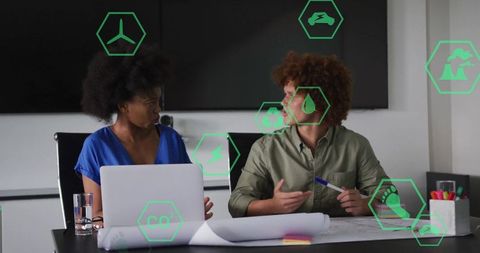 Two Professionals Collaborating on Sustainable Business Strategies