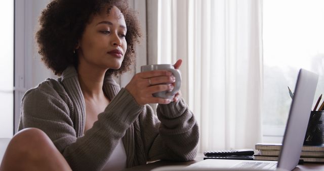 Woman With Cup of Coffee Relaxing at Home with Laptop - Download Free Stock Images Pikwizard.com