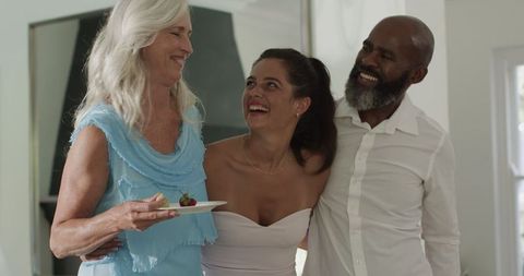 Smiling Guests Enjoying Wedding Celebration and Appetizers