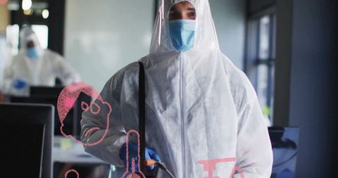 Professional sanitization worker in protective gear disinfecting office