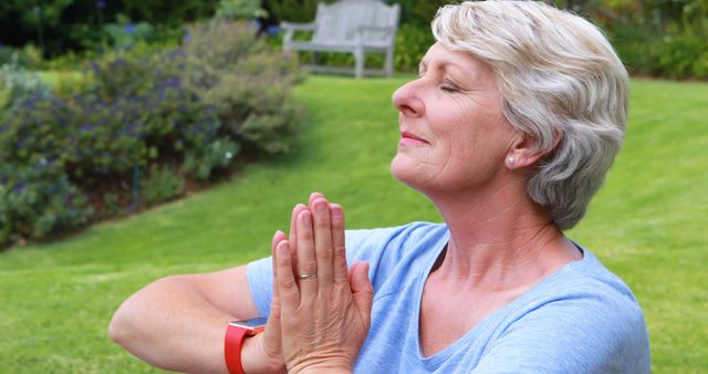 Senior Woman Meditating Outdoors with Eyes Closed in Sunny Garden - Download Free Stock Images Pikwizard.com