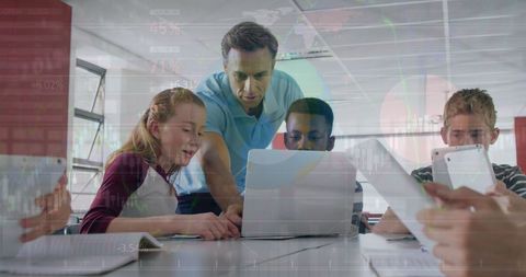 Teacher Engaging Multiracial Students with Technology in Classroom - Download Free Stock Images Pikwizard.com