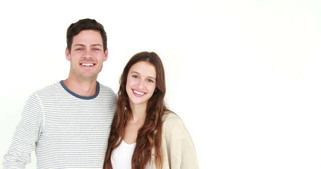 Smiling Young Couple Posing Against White Background Photography - Download Free Stock Images Pikwizard.com