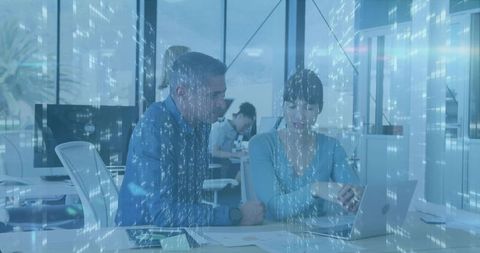 Business Professionals Analyzing Data During Collaborative Meeting